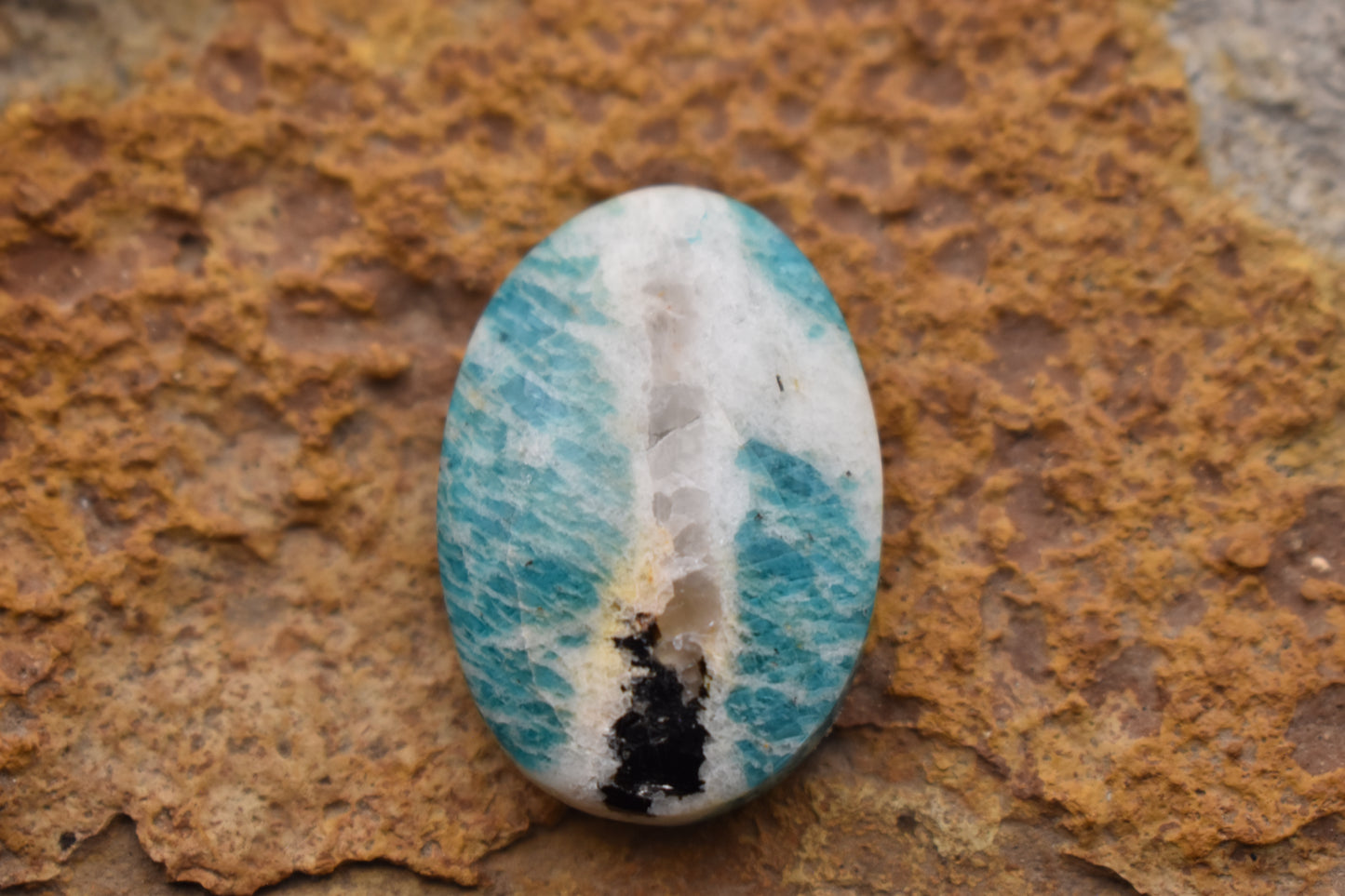 Amazonite with quartz and magnetite inclusion- Oval 32.2 x 22.5 x 7.3